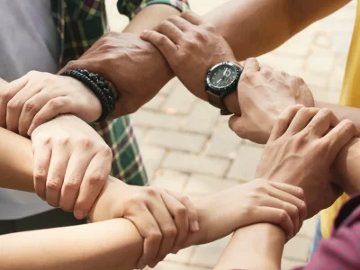 cropped-friends-holding-wrists-each-othe-chain-support-collaborate_1098-18569